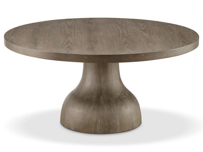 Round wooden table with a pedestal base on a white background