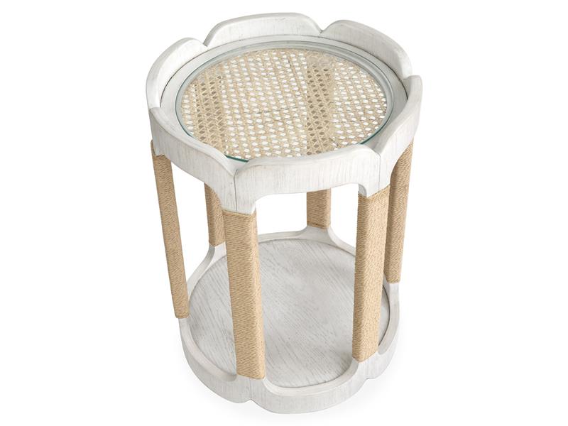 Small round table with wicker top and legs on a white background