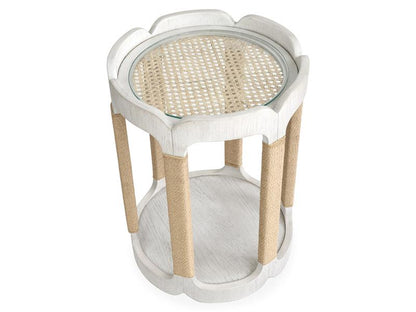 Small round table with wicker top and legs on a white background
