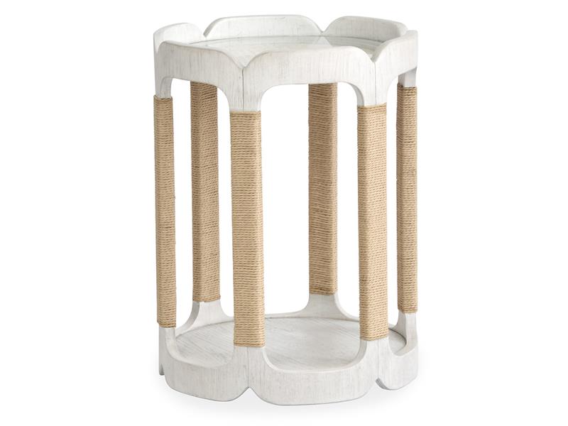 White side table with woven brown legs on a white background