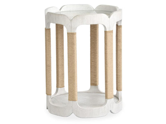 White side table with woven brown legs on a white background