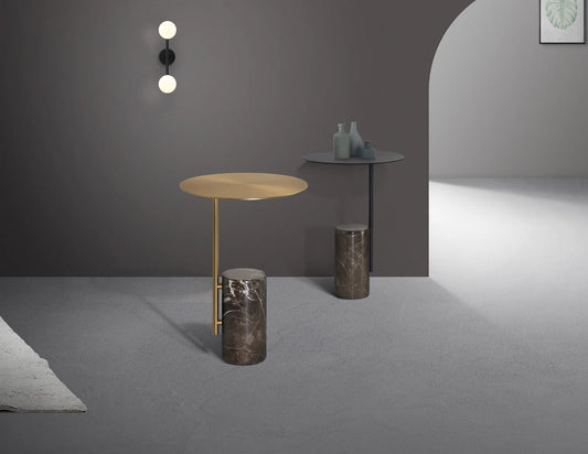 Modern interior with side tables and a wall sconce against a gray wall.