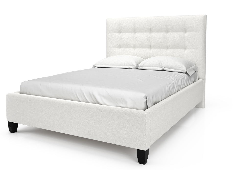 White upholstered bed with a tufted headboard on a white background
