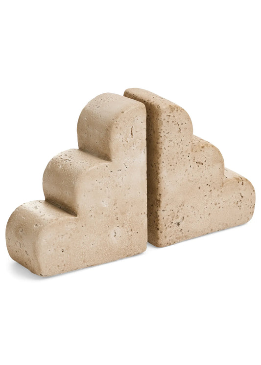 Beige stone bookends on a white background