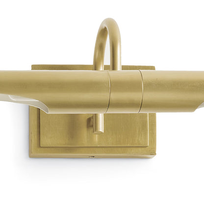 Gold wall-mounted light fixture on a white background