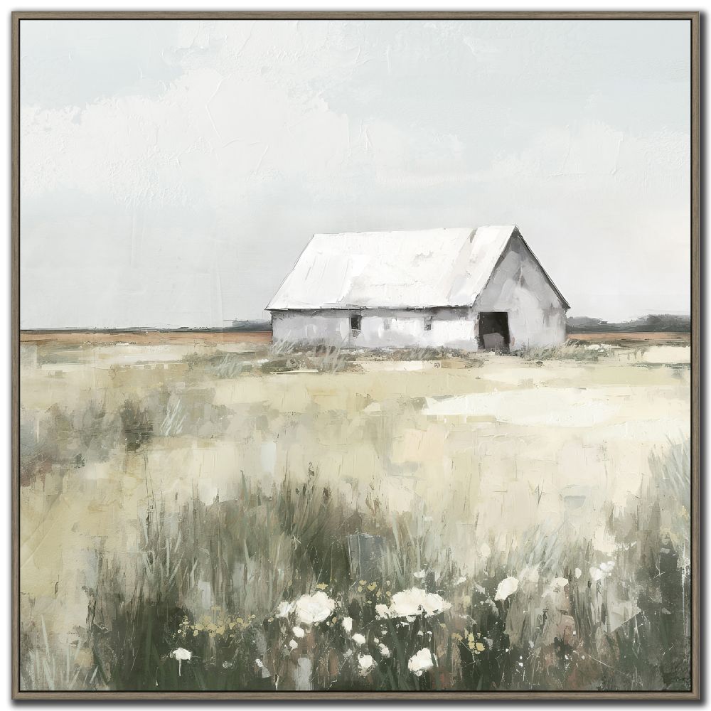 Framed artwork of a white barn in a field with flowers and a misty sky.