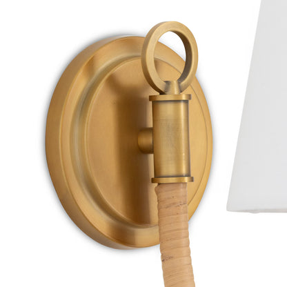 Brass wall sconce with wooden fixture on a white background
