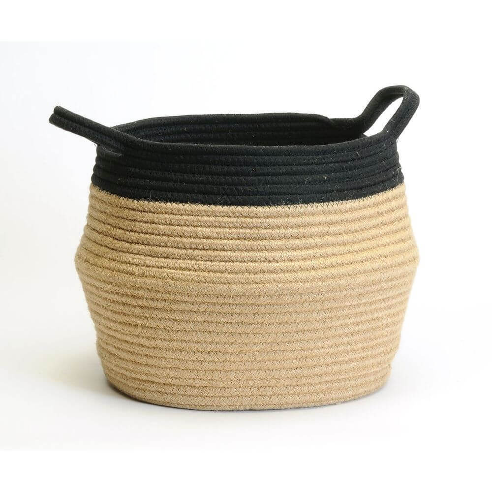Woven basket with black top and beige bottom on a white background